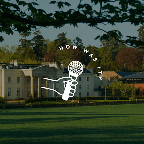 A white Georgian-style building surrounded by green fields and trees, overlaid with the text “How was it?” and a white hand holding a microphone graphic.