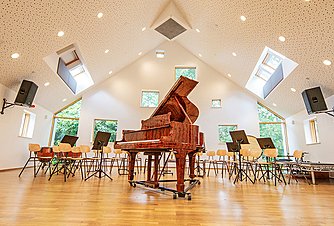an open piano in a music classroom at Frensham Heights School