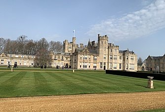 Historic boarding school building with large lawn and classic architecture