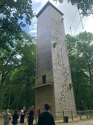 Tall climbing tower with safety ropes used for outdoor training
