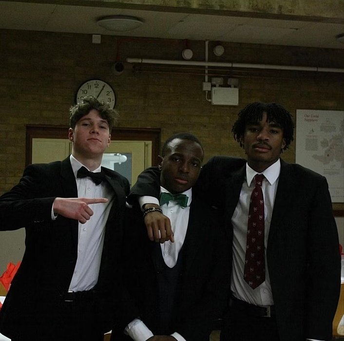 Three boys in tuxedos – ready for dinner.