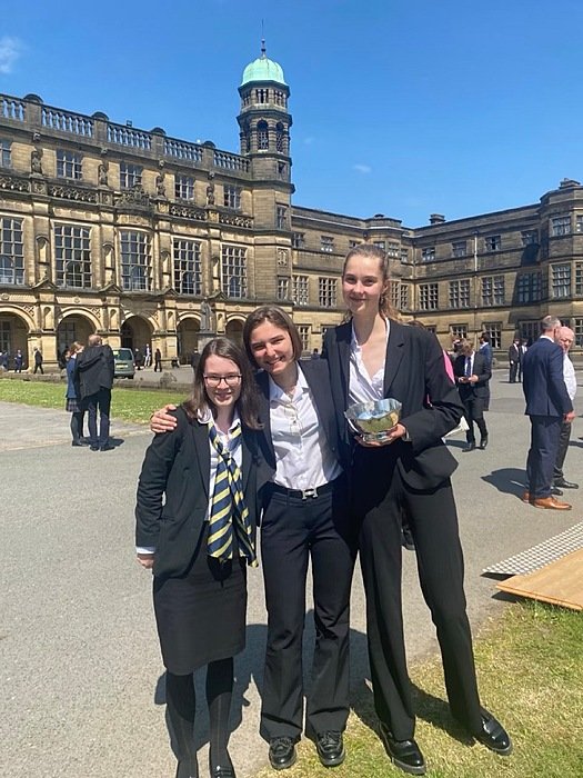 Pupil Charlotte with two friends on Stonyhurst School campus