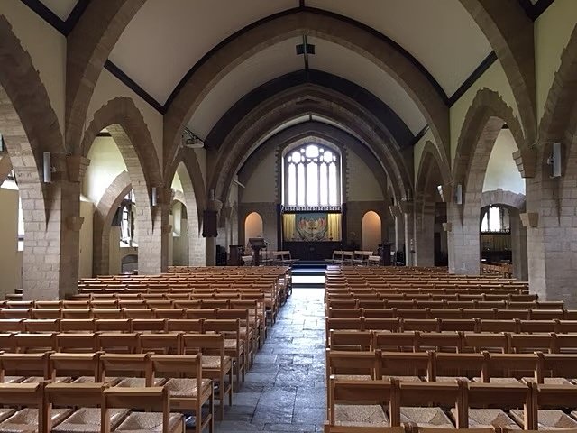 Old chapel, simple, no pictures, only wooden chairs