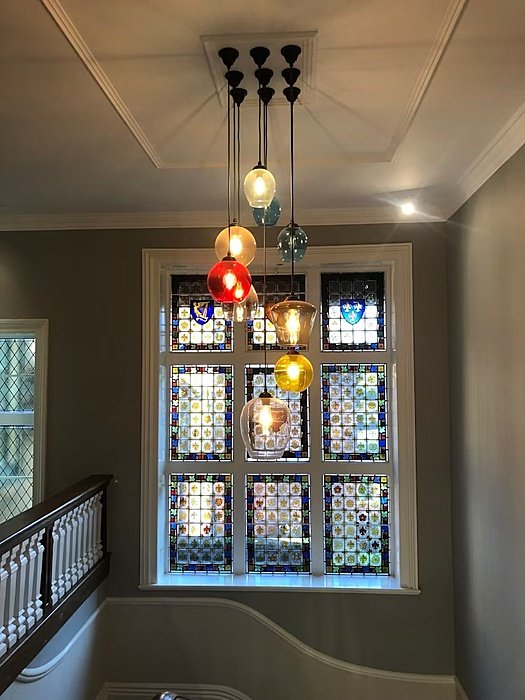 Colourful hanging lamps in a stairwell