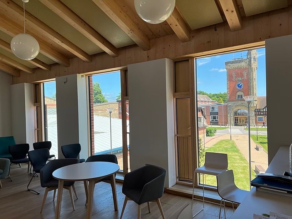 room with long windows, chairs and tables