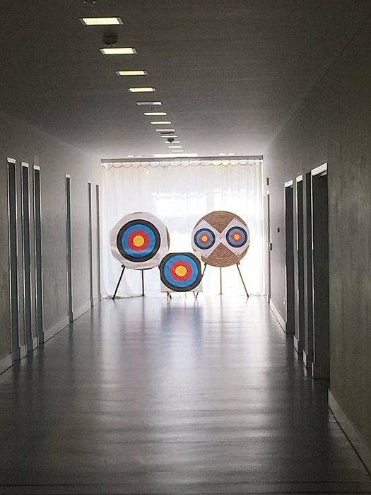 three targets at the end of a corridor