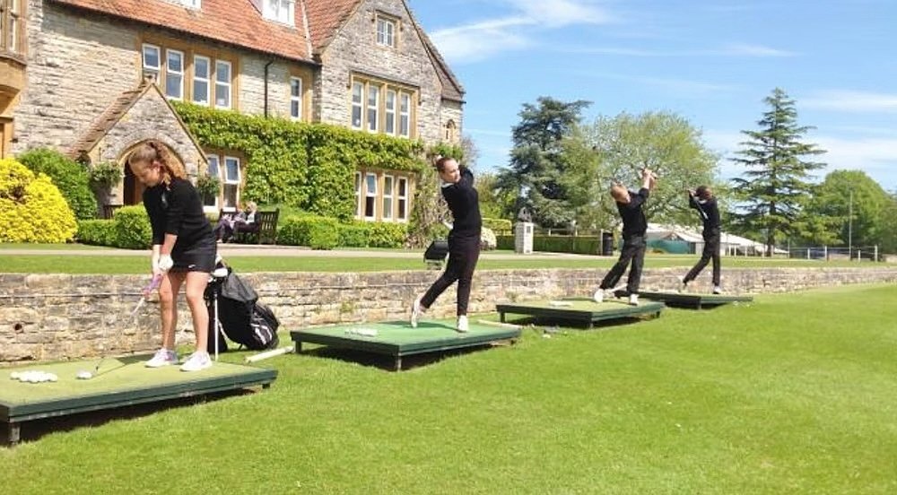 Students practicing Golf on the school's driving range