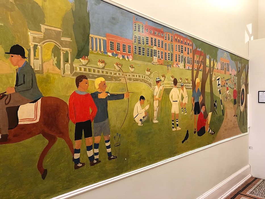 a large painting of the school with children doing sport