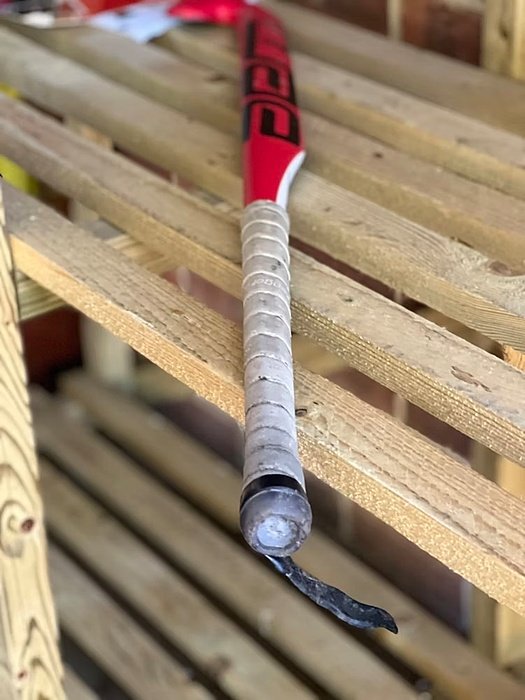 Hockey red racket on a shelf