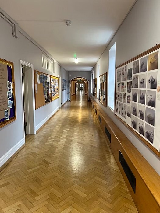 A long corridor with wooden floor