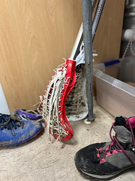 Lacrosse racket and dirty shoes