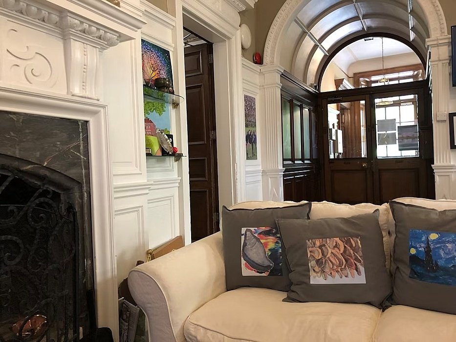 Cozy reception area with chimea and sofa