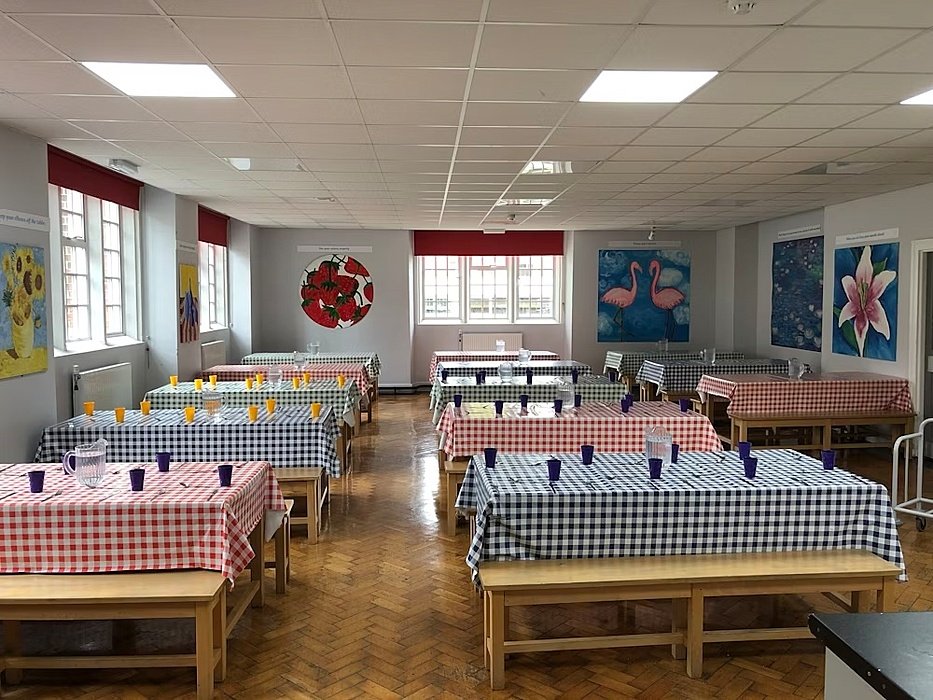 Dining hall with blue and red tables