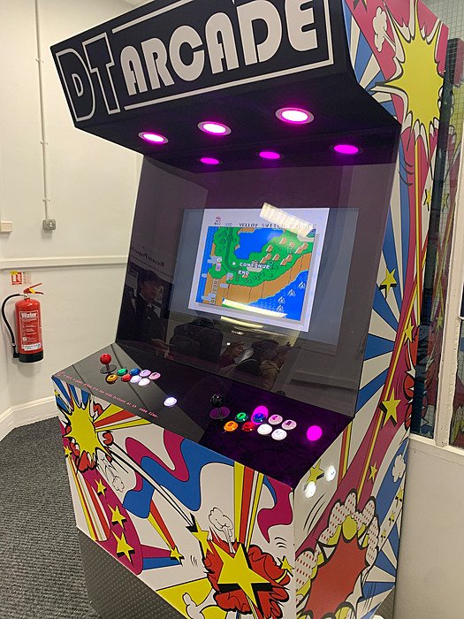 Retro arcade machine inside a school building