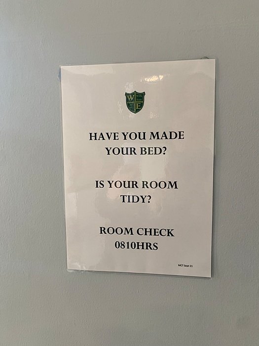 Boarding house notice about room inspection