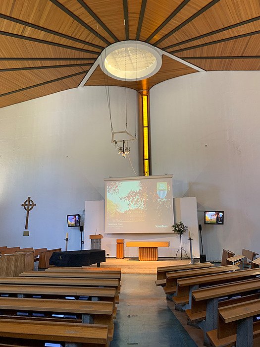 School chapel with altar and seating. Chapel, worship, tradition, campus.