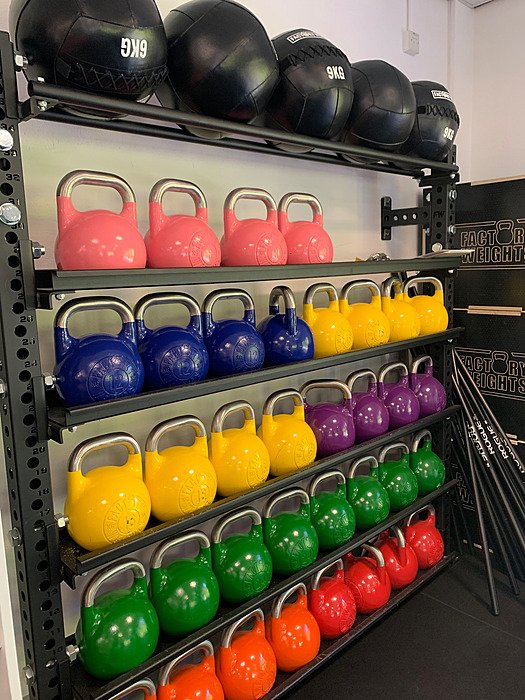 Kettlebells in the school gym. Strength training, sport, fitness.