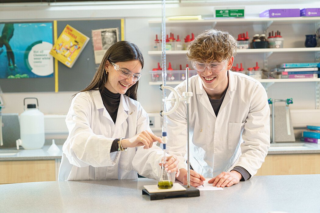 Students doing an experiment during a science lesson at St Clare's Oxford Summer School t