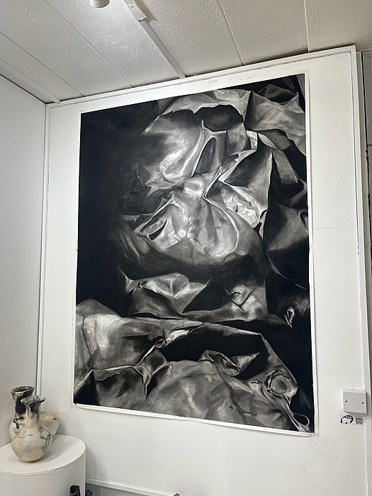 Large charcoal artwork displayed in St Edward’s Oxford art studio.