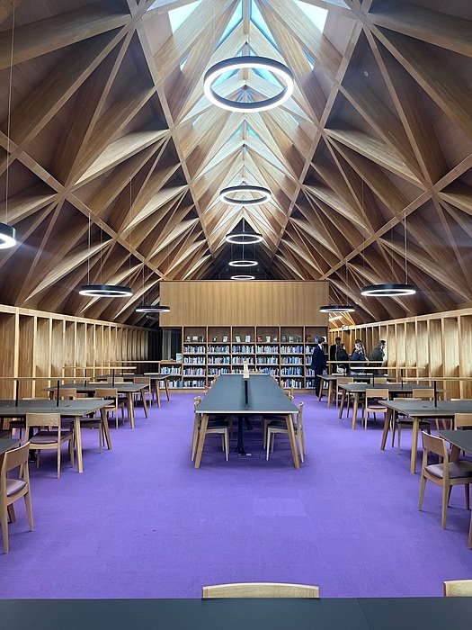 Library at St Edward’s Oxford with timber roof and study tables.