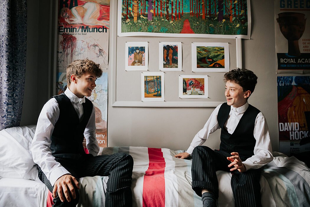 Two students in a boys boarding room in a boarding house at Eton College