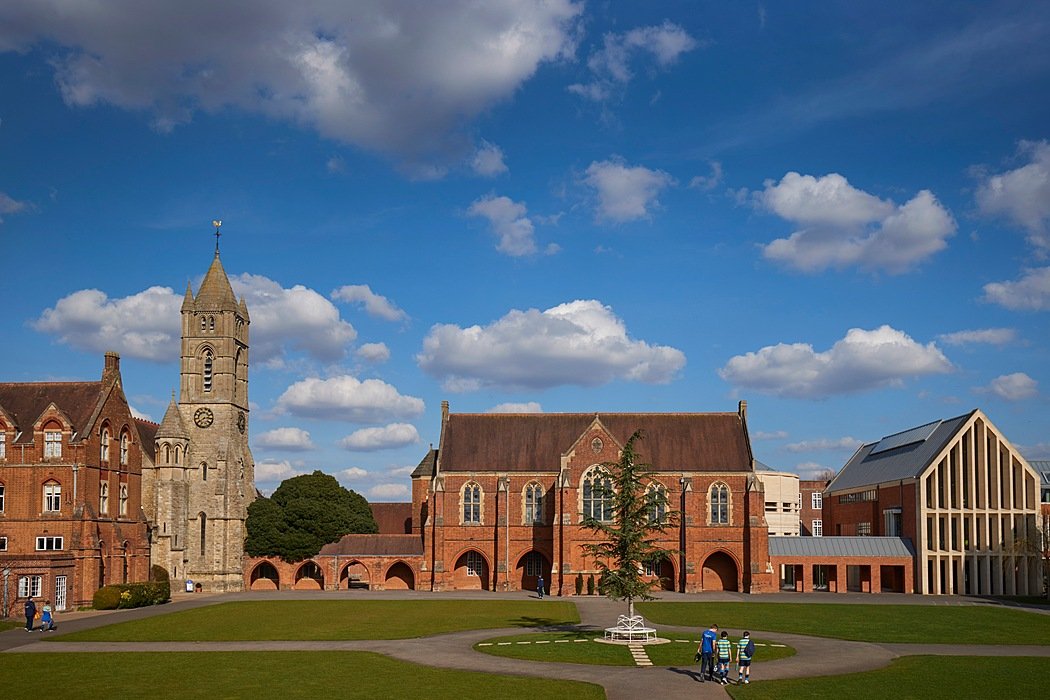 Victorian British boarding school with large green lawn