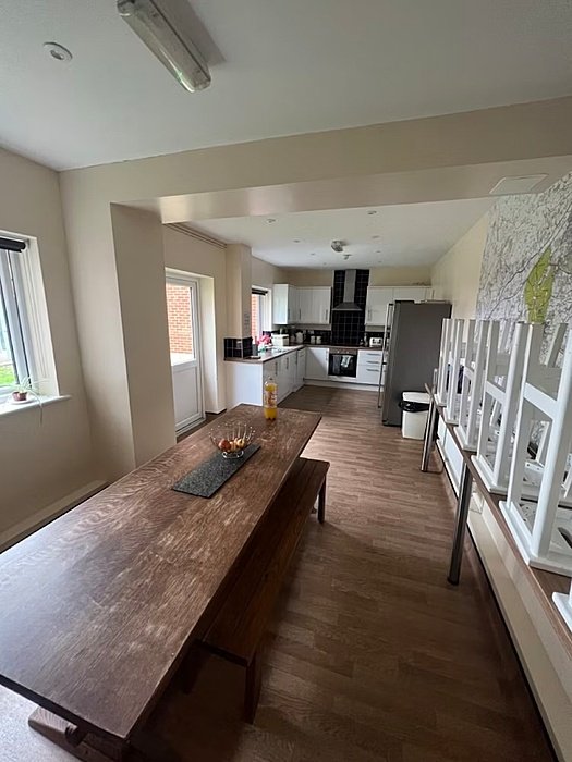 Kitchen with long wooden table