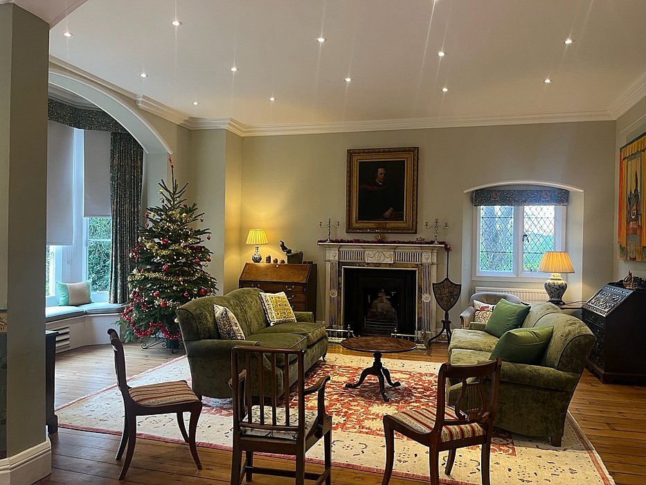 Cosy common room at St Edward’s Oxford with fireplace and Christmas tree.