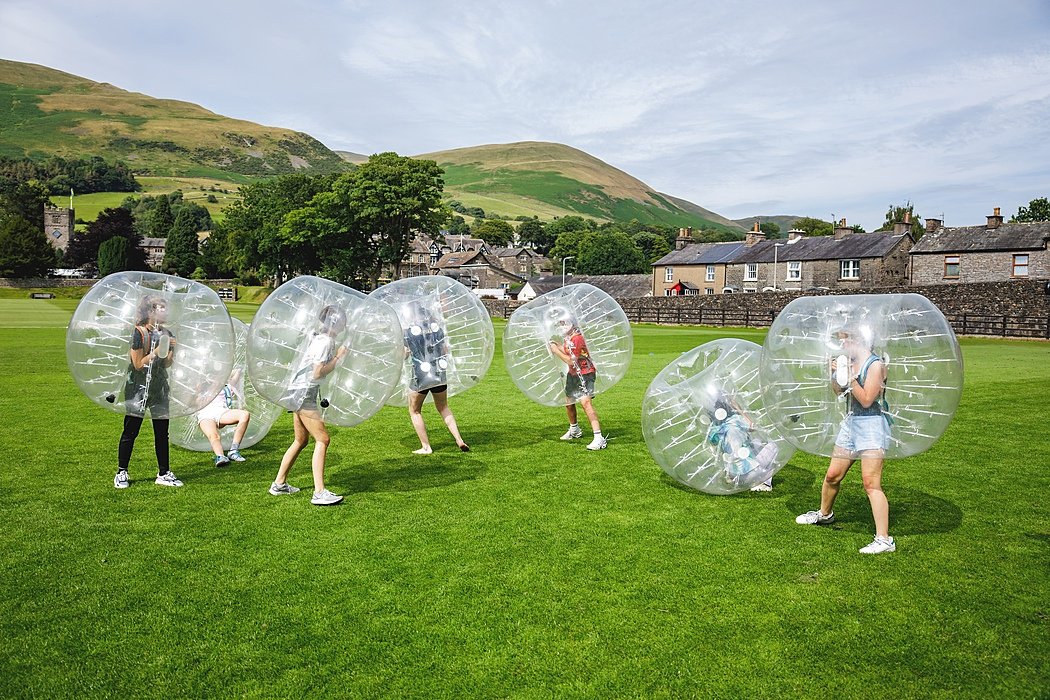 Students of the Sedbergh International Summer School doing Zorbing outside