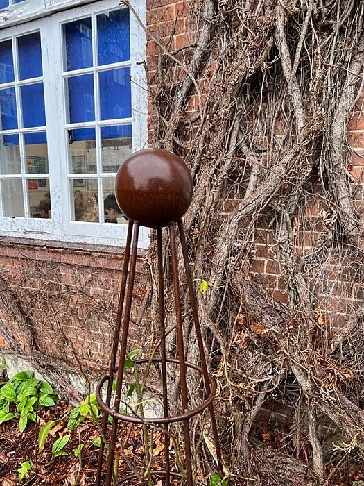 A metal object in the garden outside a classroom at Sutton Valence School