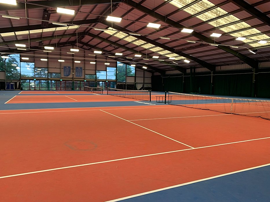 ndoor tennis courts at an English boarding school — professional sports facilities for students.