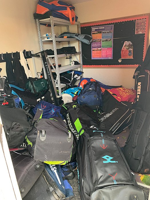 Sports bags and equipment in storage room