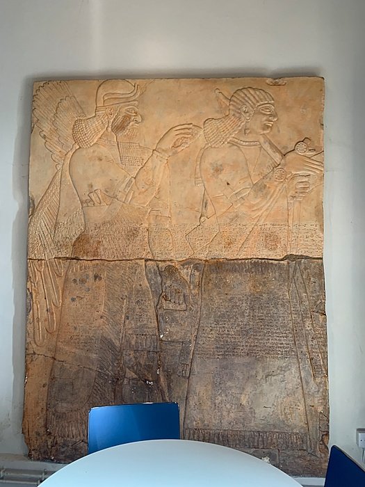 Ancient stone relief with carved figures