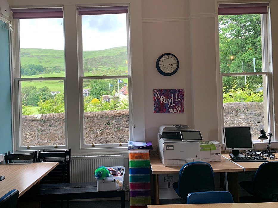 Bright boarding room with study desk overlooking the Scottish hills.