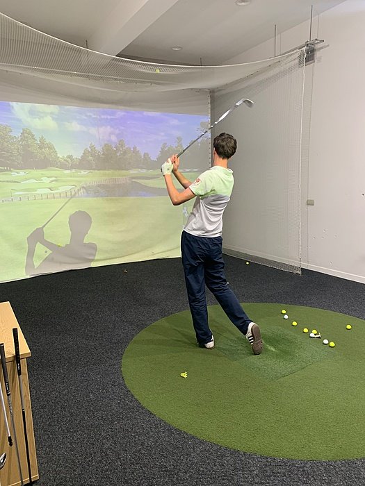 Indoor golf simulator at the Loretto Golf Academy.