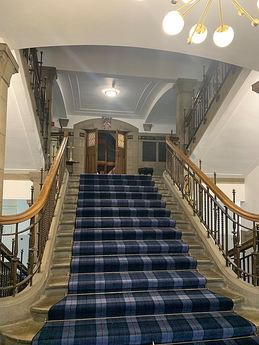 Grand entrance hall with central staircase.