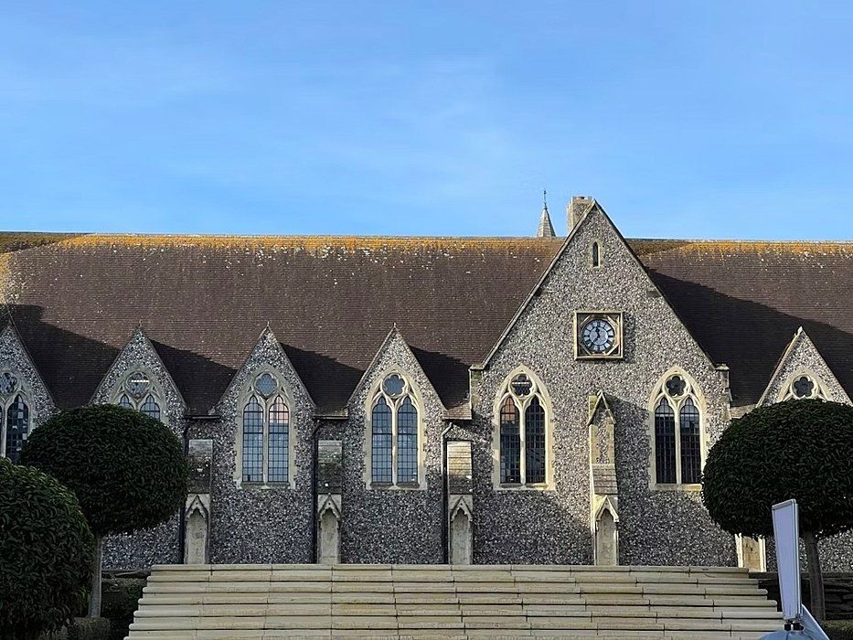 An inner courtyard with lots of stone stairs leading up to Lancing College