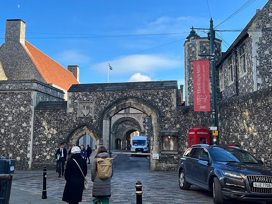 One of the entrances to the school campus with stone archways and stunning buildings