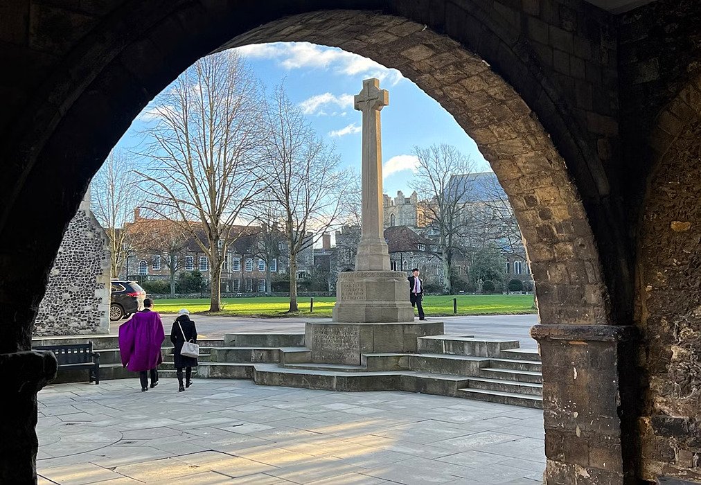 View through a stone Archway onto the campus at King's School Canterbury