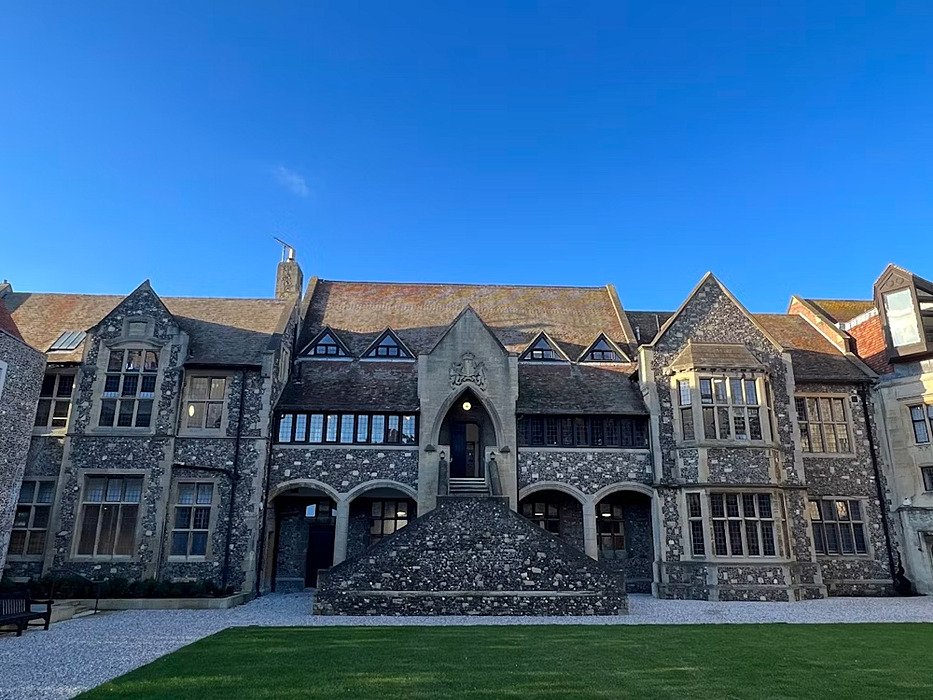 a stunning stone staircase outside leading up to the beautiful old school building