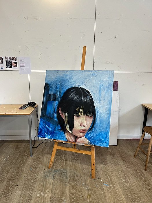Painting on easel in boarding school art studio