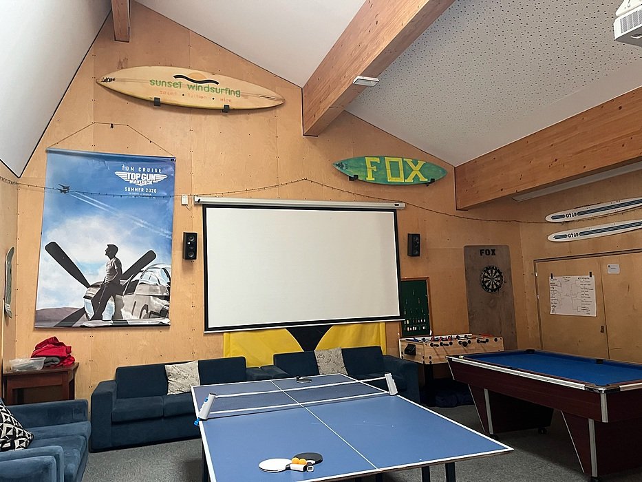 Boarding house common room with table tennis, projector and lounge seating