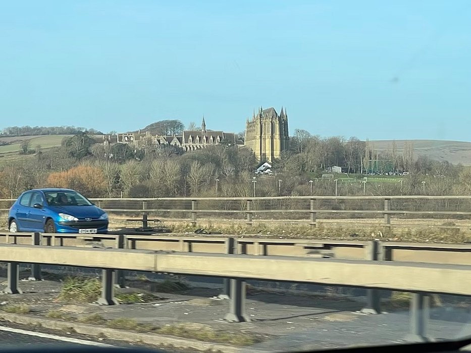 view from the motorway of Lancing College in the distance