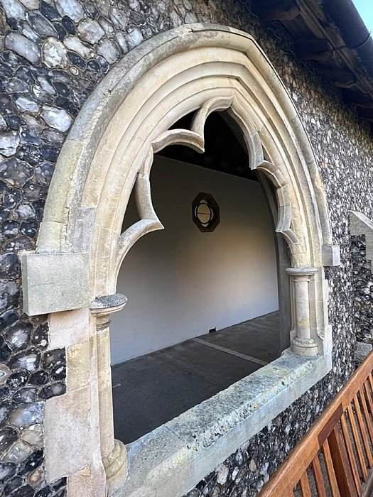 A beautiful Gothic window in a stone wall