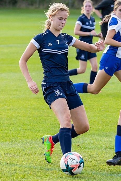 Girl plays football