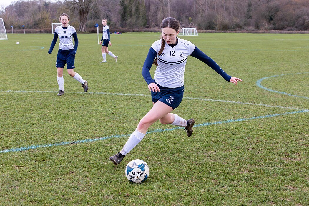 Girls plays football