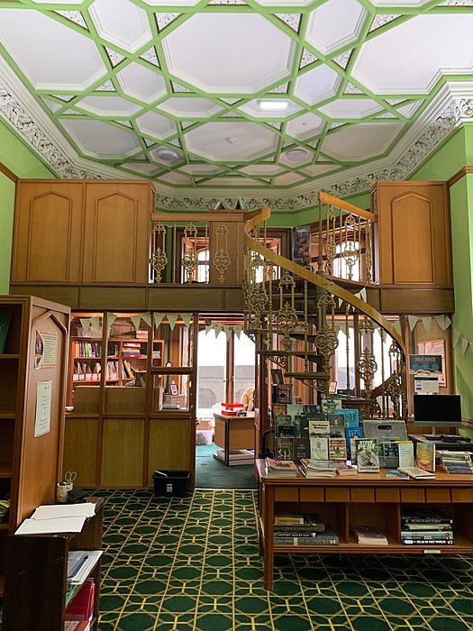 Library with gallery and historic interior architecture.