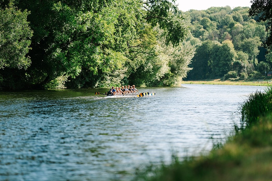 Panoramic shot of Bryanston's rowing team on a river