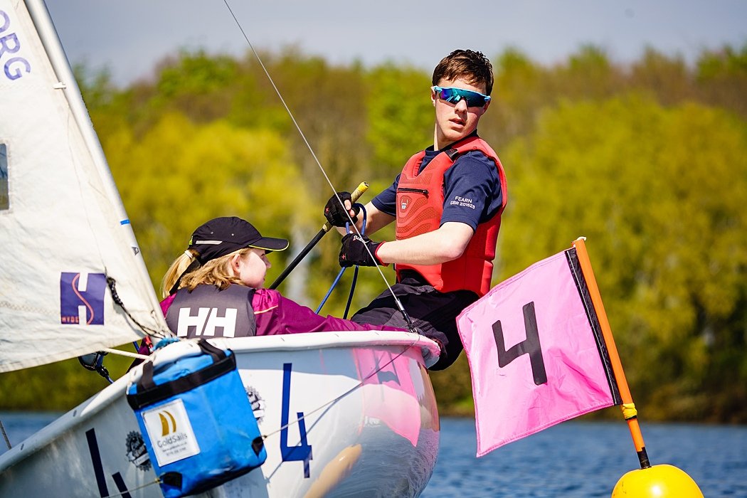 two sailing students in a boat at Rutland Water, racing