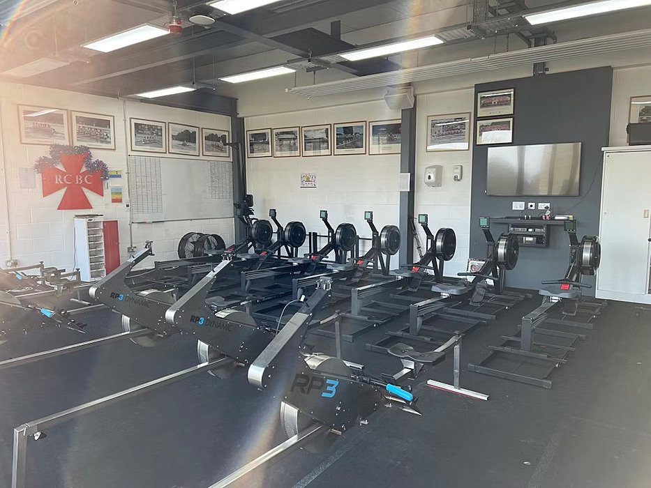 Seven rowing machines in the gym